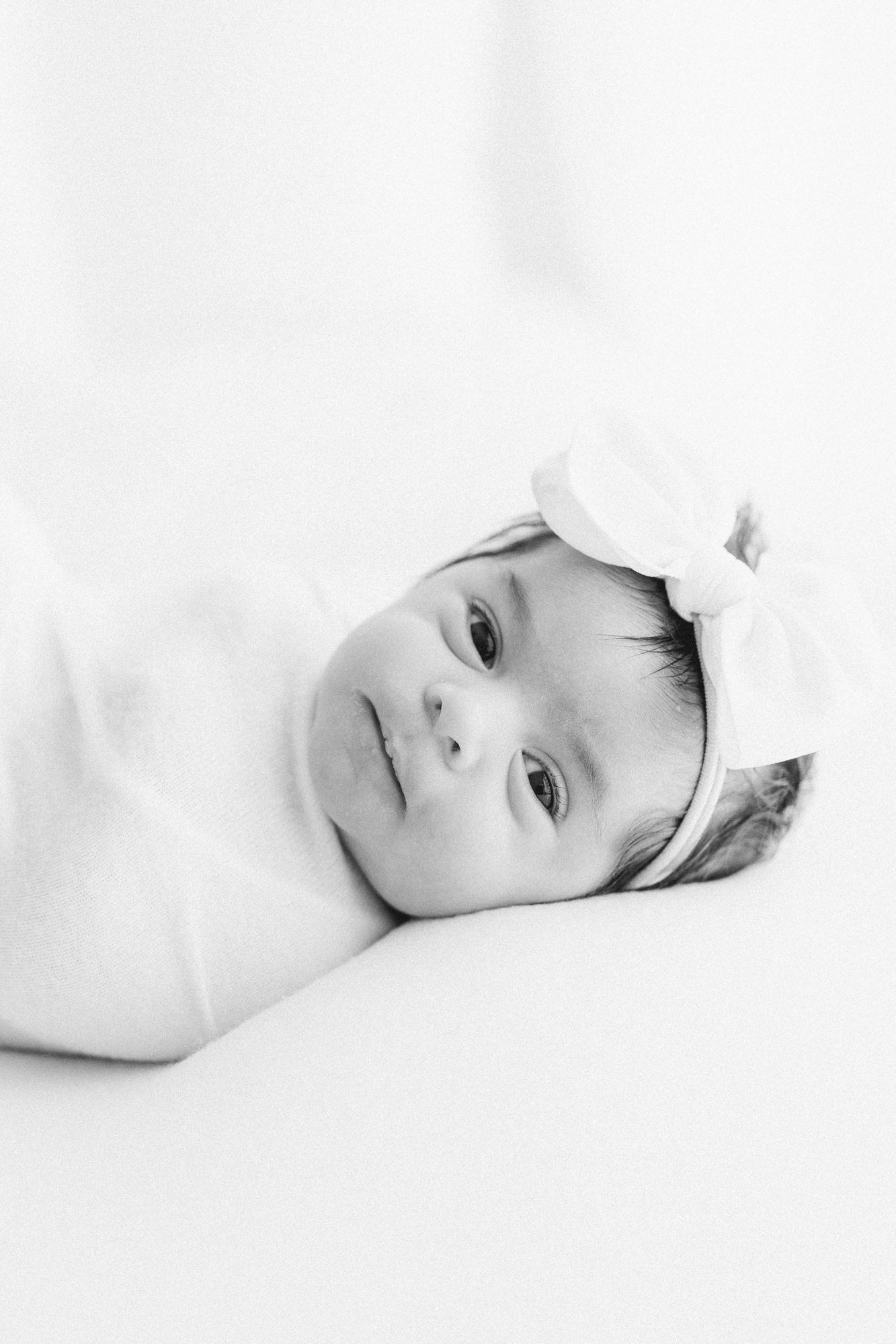black and white image of newborn baby in mckinney