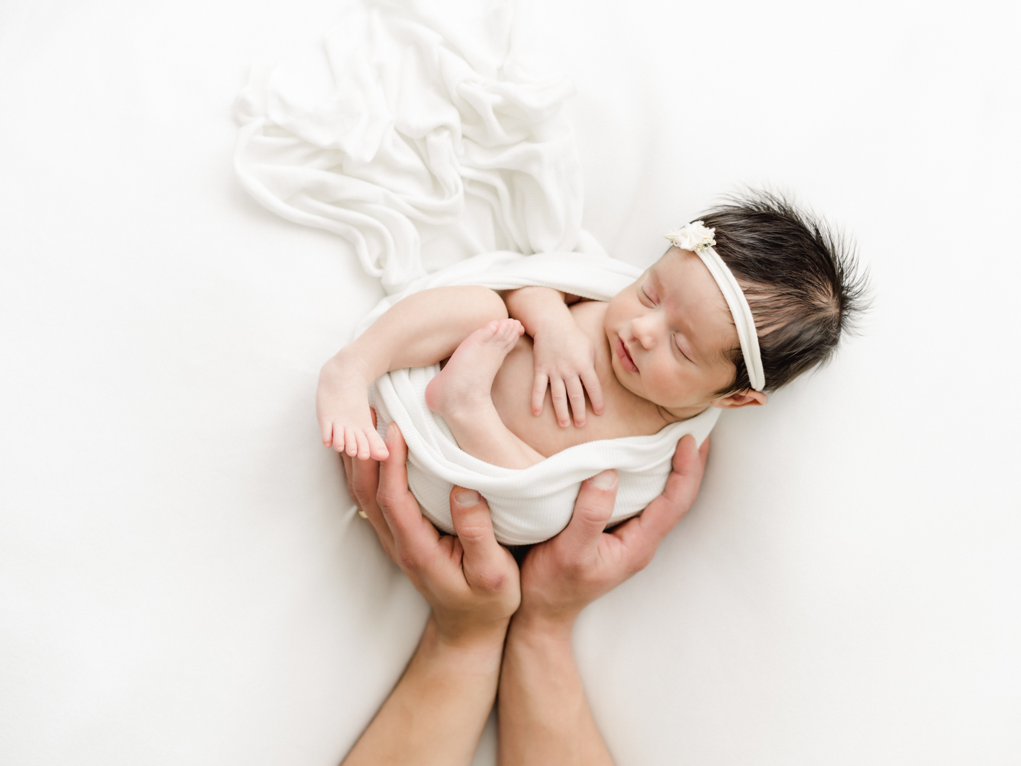 lifestyle posed newborn photo with hands